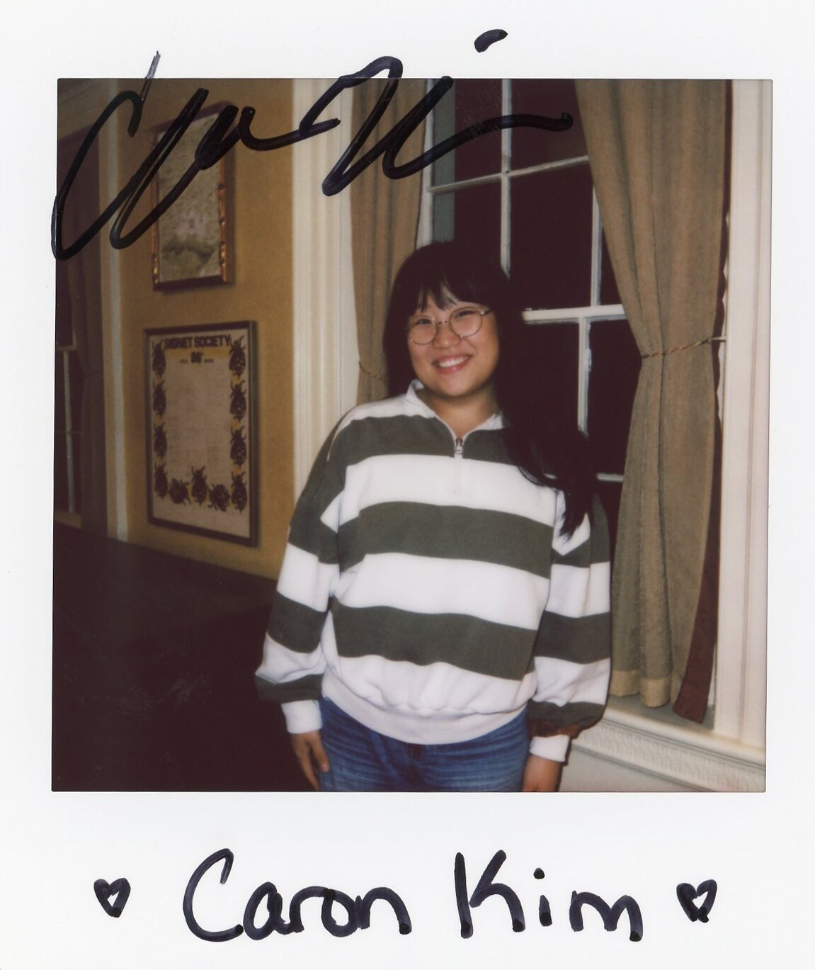 Signed cast Polaroid portrait of Caron Kim.