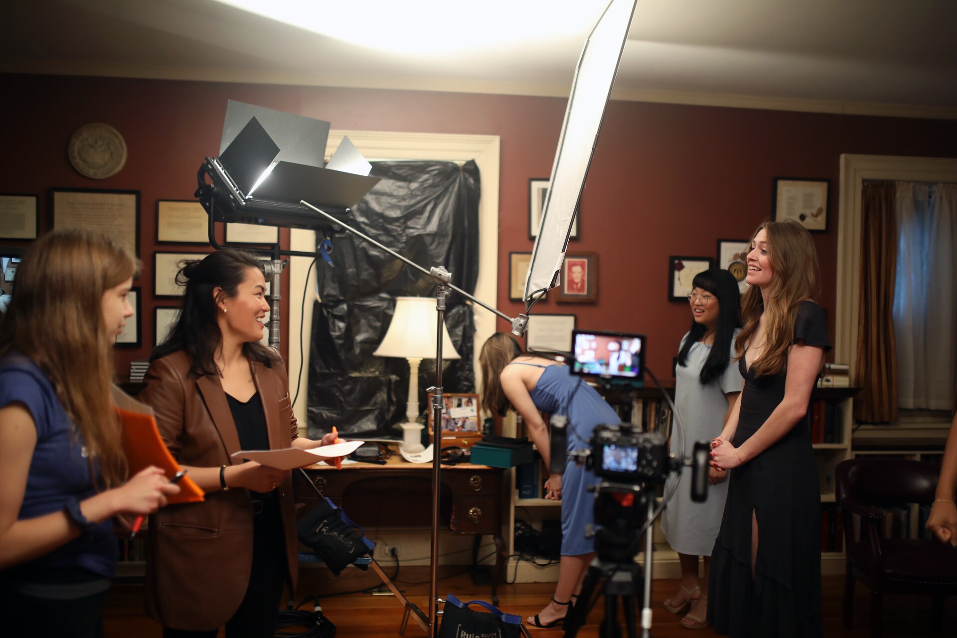 Behind-the-scenes view of Commencement Eve being filmed inside the Signet Library.