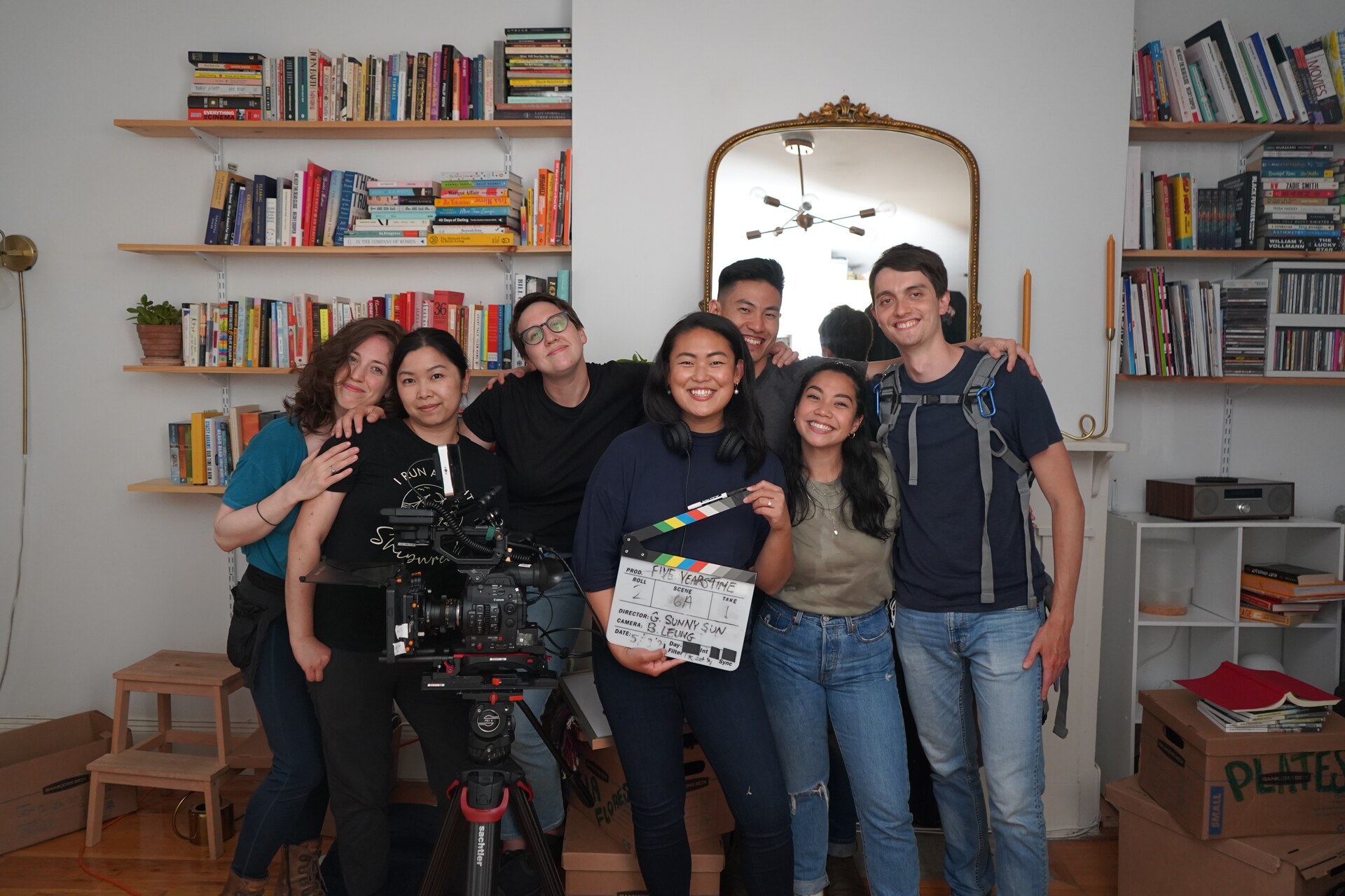 Five Years Time cast and crew group portrait gathered around a cinema camera and slate.