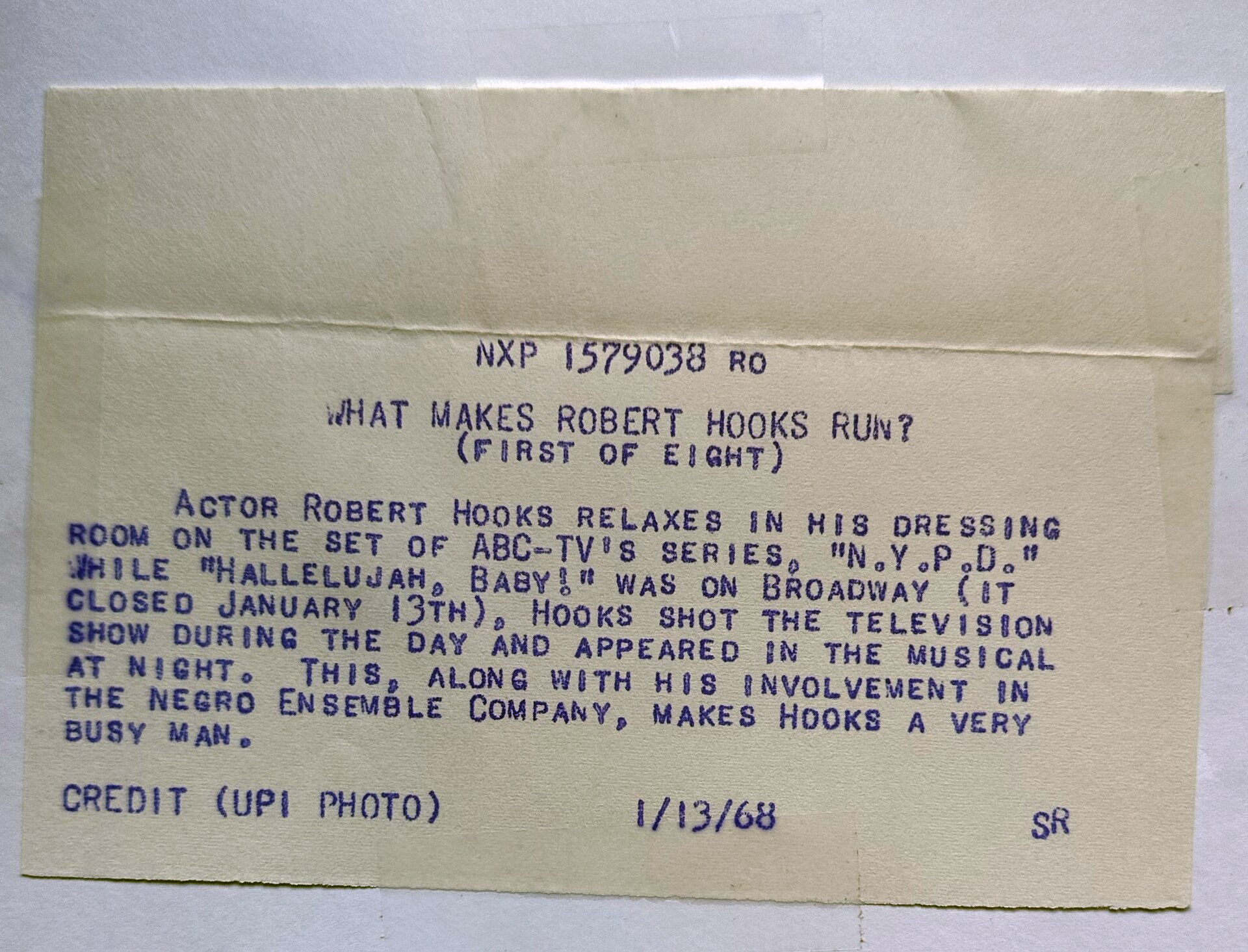 Typed archival photo credit describing actor Robert Hooks during Hallelujah, Baby!