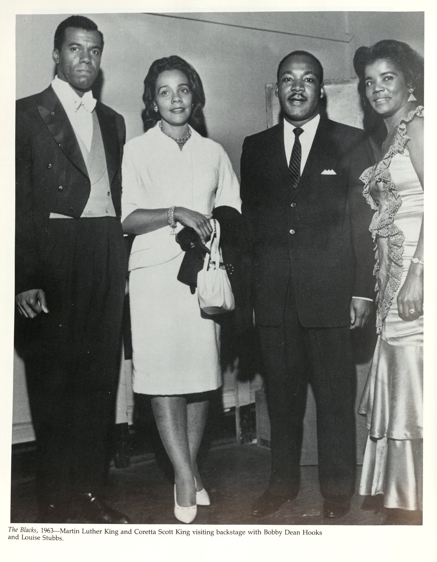 Black-and-white archival photograph including Robert Hooks at a formal gathering.