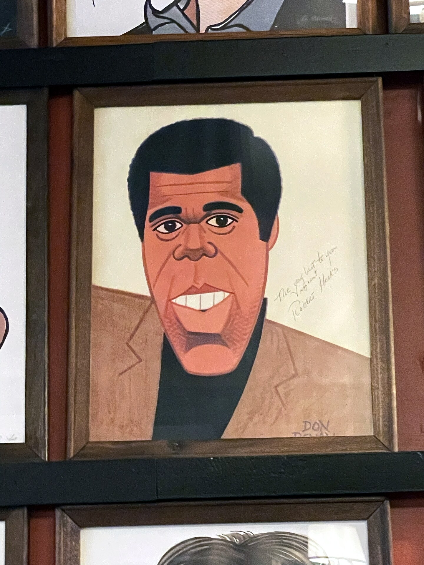 Framed Sardi's caricature portrait of Robert Hooks.