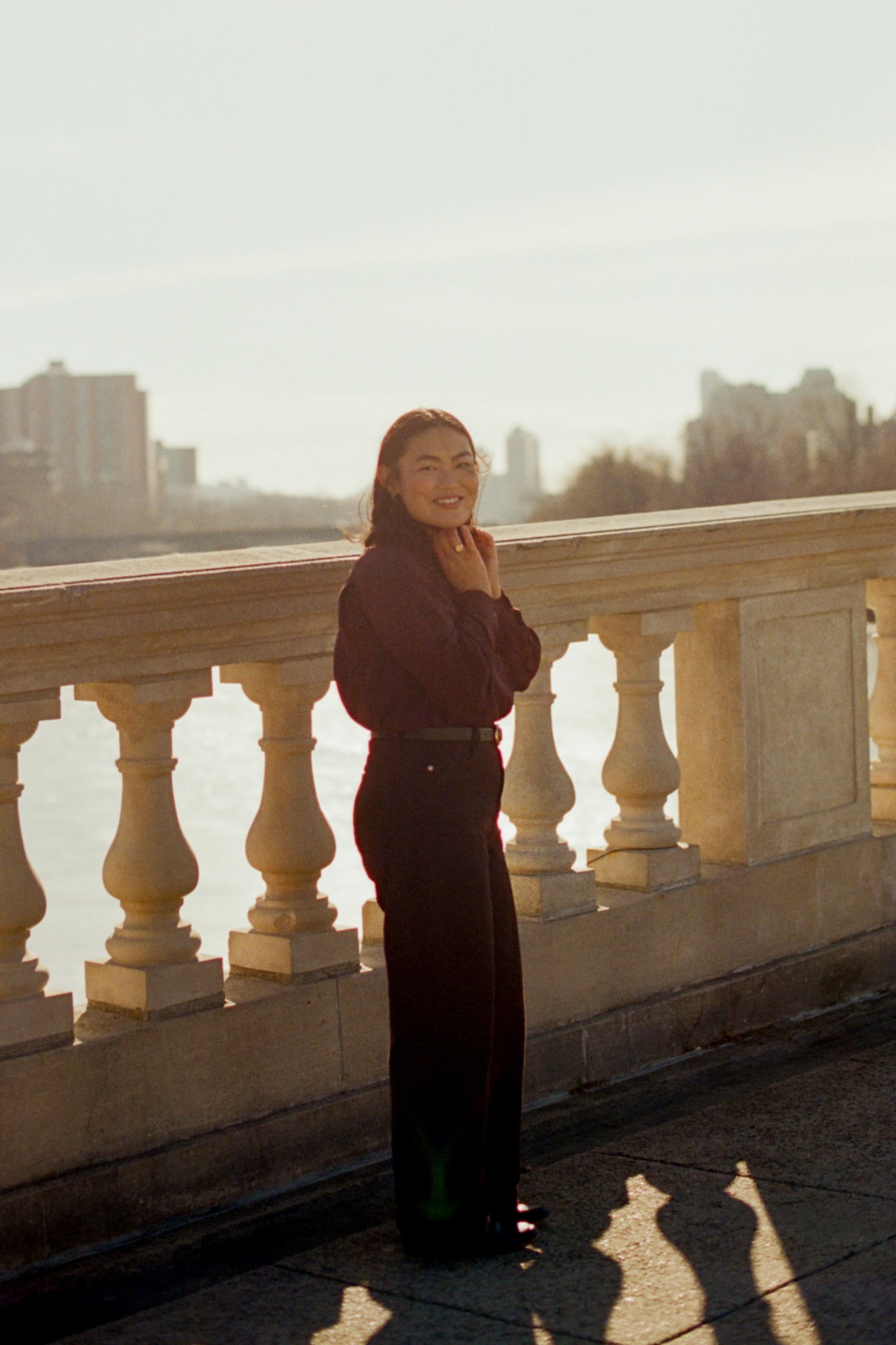 Portrait of Grace Sunny Sun overlooking the water.